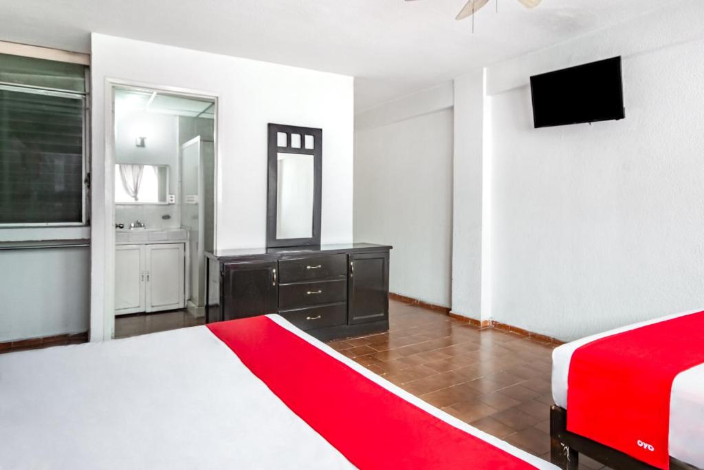 Postel nebo postele na pokoji v ubytování OYO Hotel Halley