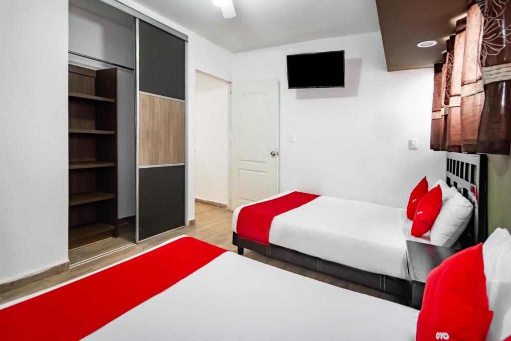 Postel nebo postele na pokoji v ubytování OYO Hotel Halley