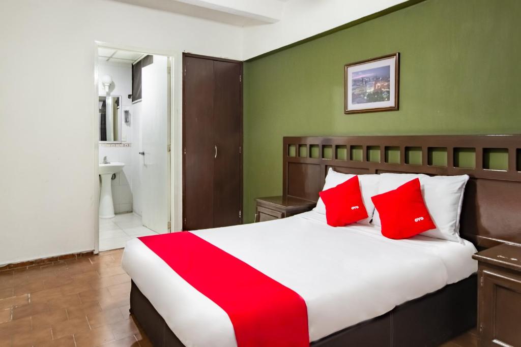 Postel nebo postele na pokoji v ubytování OYO Hotel Halley