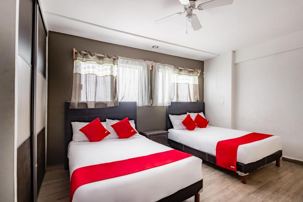 Postel nebo postele na pokoji v ubytování OYO Hotel Halley