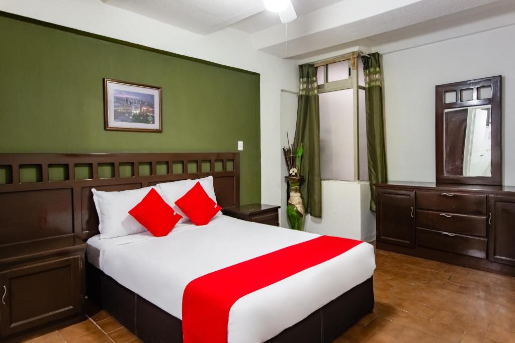Postel nebo postele na pokoji v ubytování OYO Hotel Halley