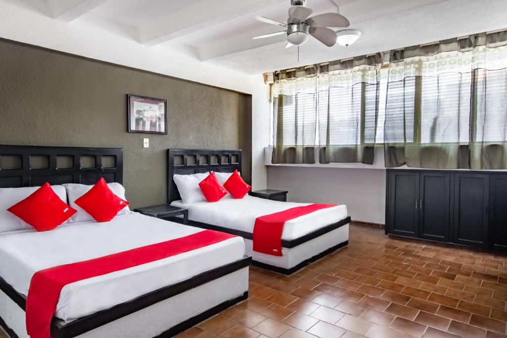 Postel nebo postele na pokoji v ubytování OYO Hotel Halley