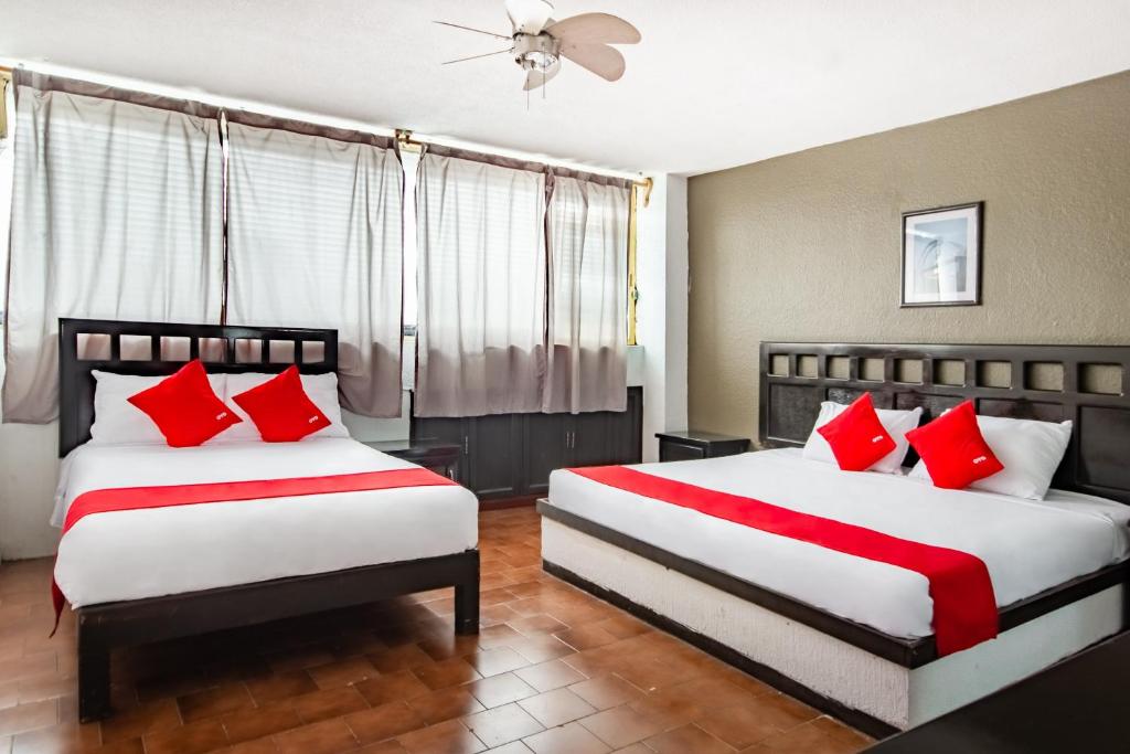 Postel nebo postele na pokoji v ubytování OYO Hotel Halley
