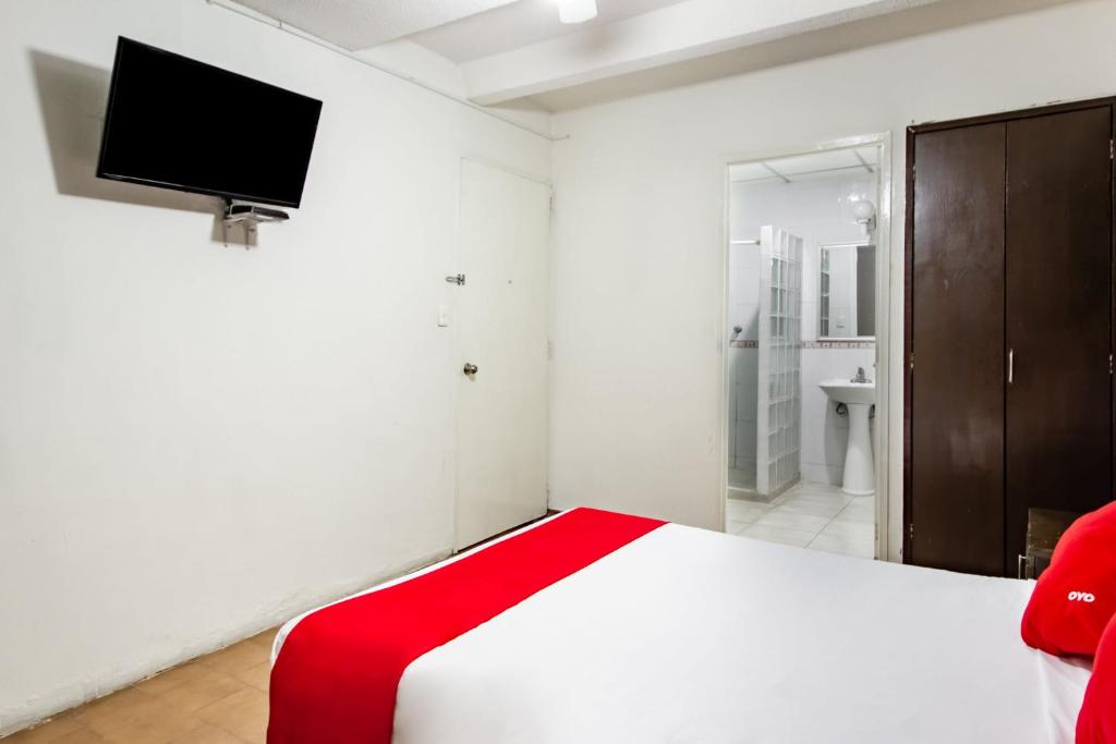 Postel nebo postele na pokoji v ubytování OYO Hotel Halley