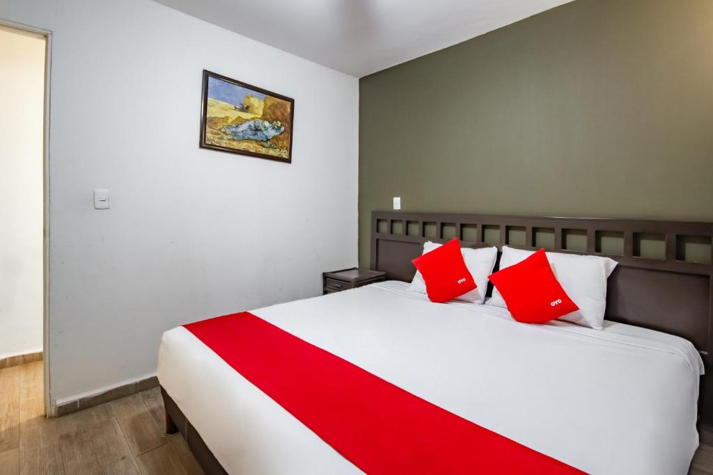 Postel nebo postele na pokoji v ubytování OYO Hotel Halley