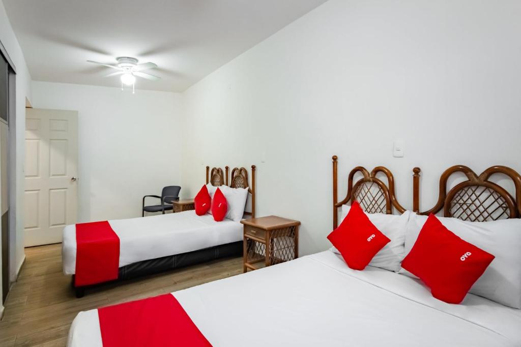Postel nebo postele na pokoji v ubytování OYO Hotel Halley