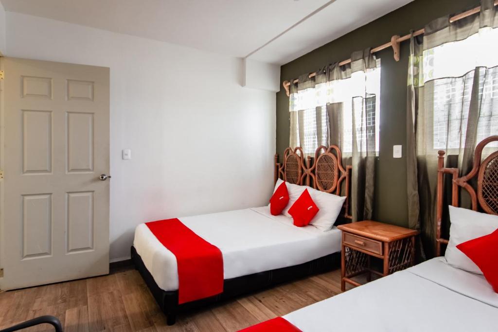 Postel nebo postele na pokoji v ubytování OYO Hotel Halley
