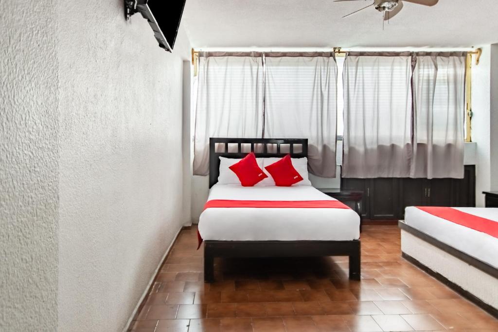Postel nebo postele na pokoji v ubytování OYO Hotel Halley