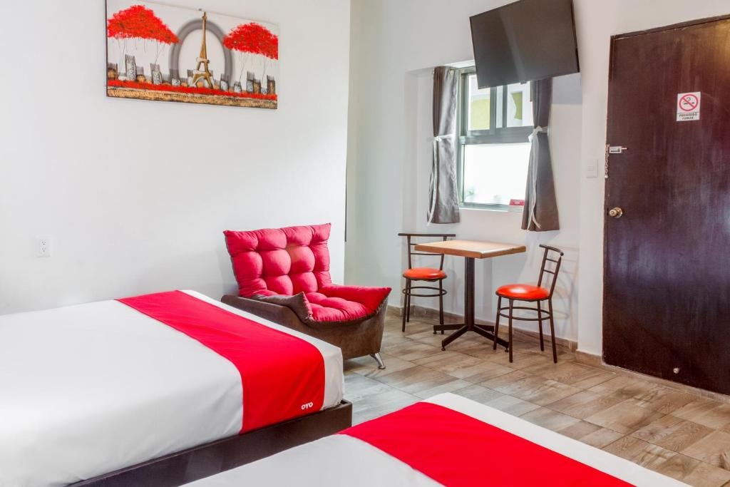 Postel nebo postele na pokoji v ubytování OYO Hotel Gandag