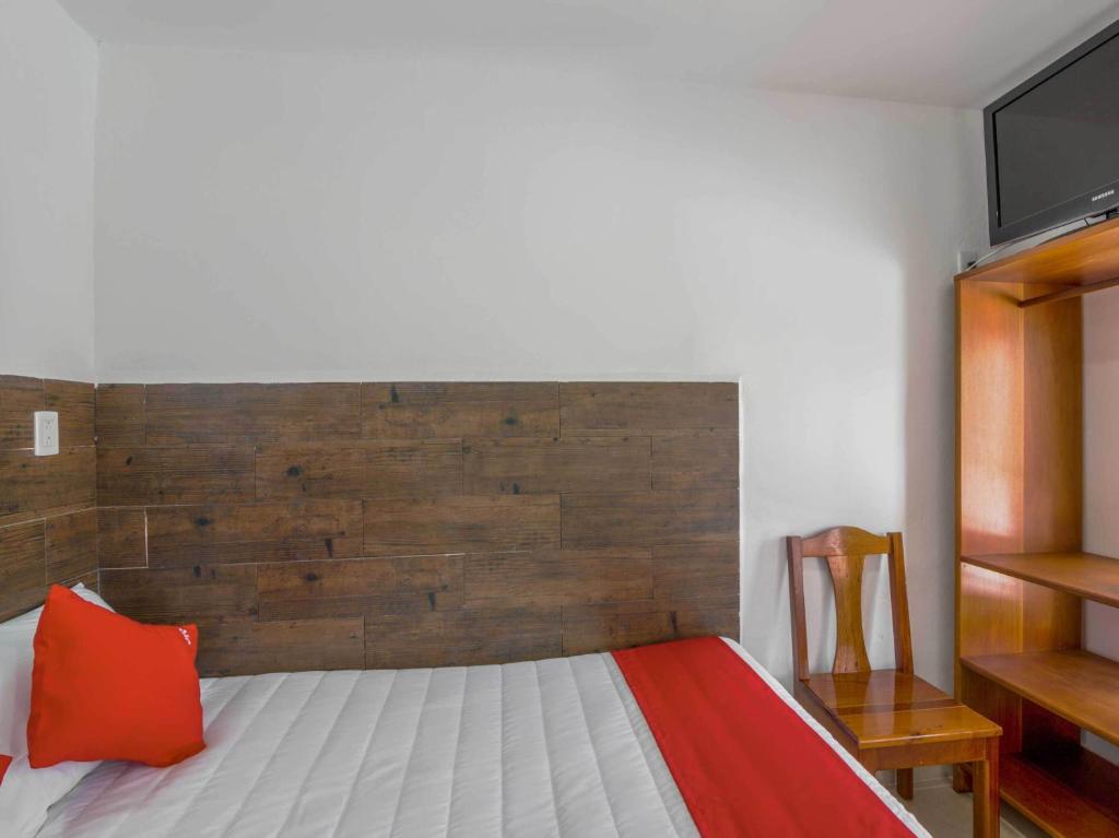 Postel nebo postele na pokoji v ubytování OYO Hotel Palma Real