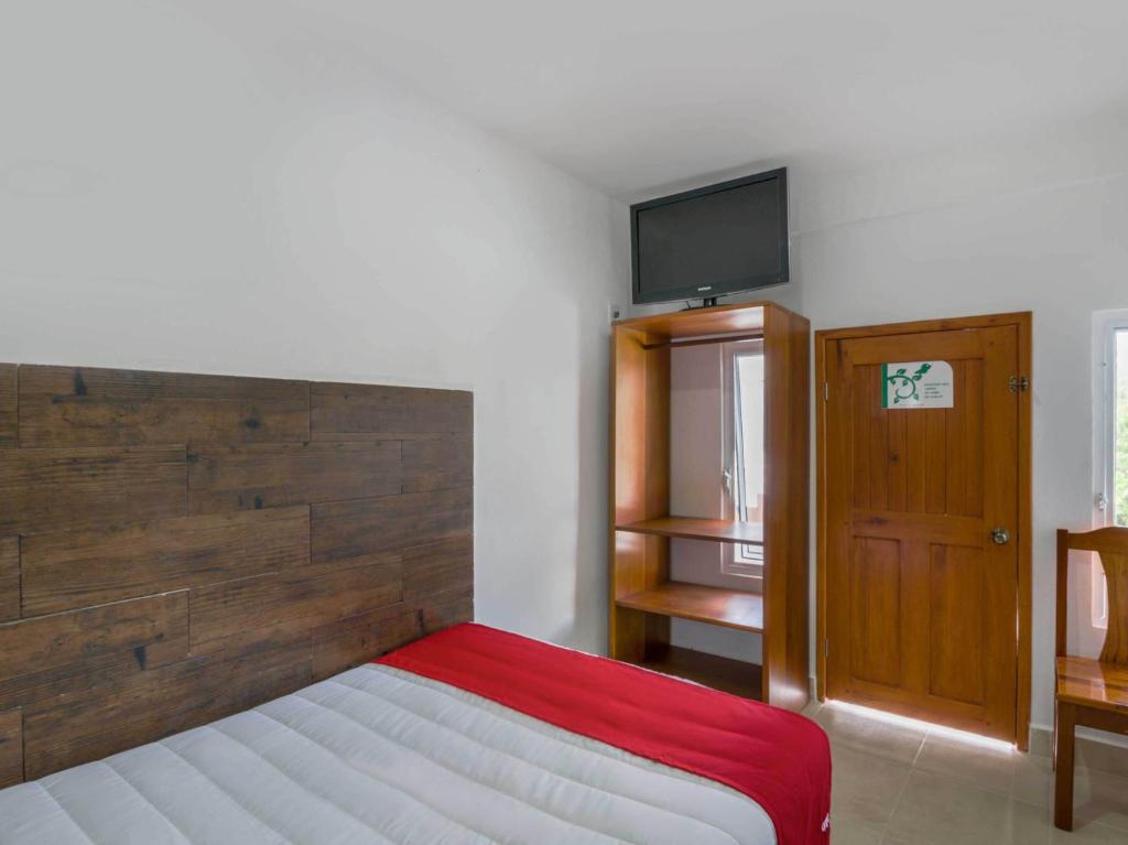 Postel nebo postele na pokoji v ubytování OYO Hotel Palma Real