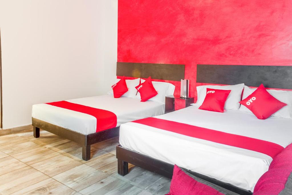 Postel nebo postele na pokoji v ubytování OYO Hotel Gandag