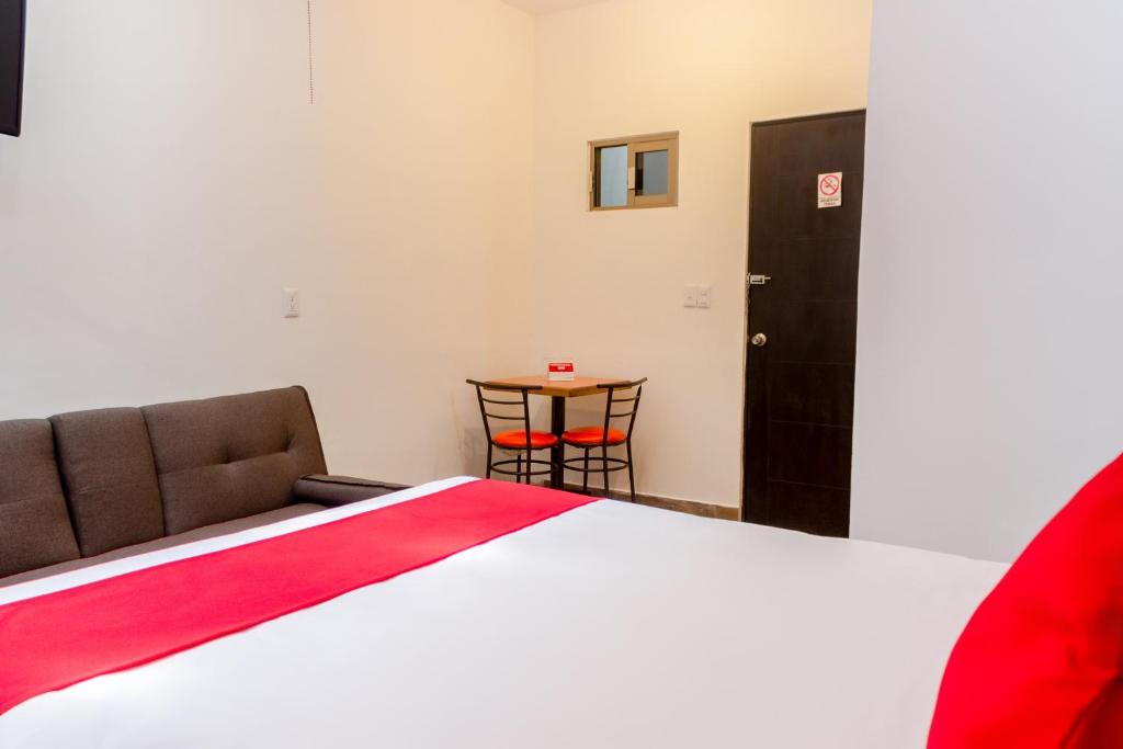 Postel nebo postele na pokoji v ubytování OYO Hotel Gandag