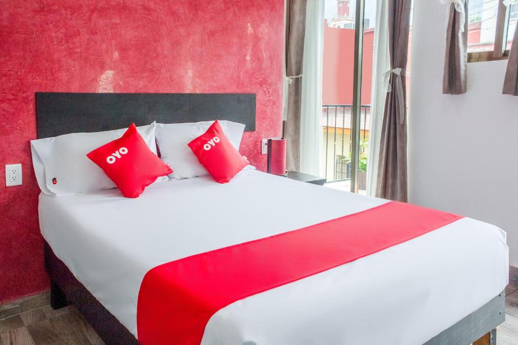 Postel nebo postele na pokoji v ubytování OYO Hotel Gandag