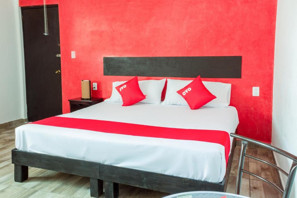 Postel nebo postele na pokoji v ubytování OYO Hotel Gandag