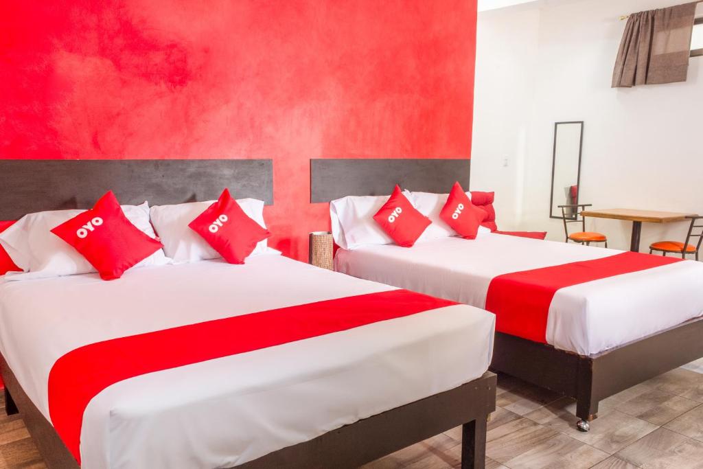 Postel nebo postele na pokoji v ubytování OYO Hotel Gandag