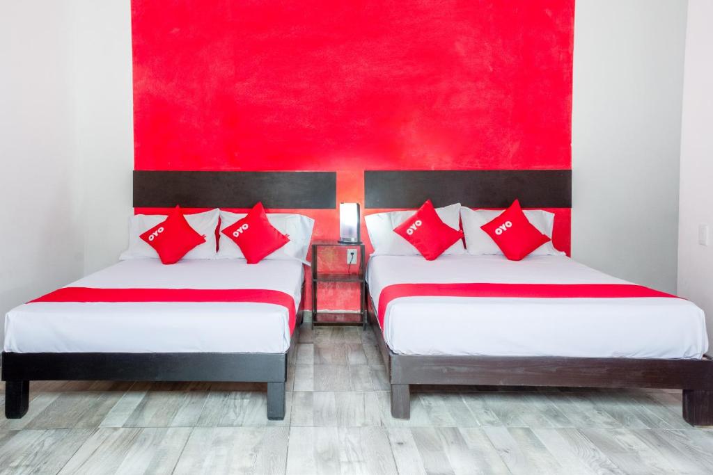 Postel nebo postele na pokoji v ubytování OYO Hotel Gandag