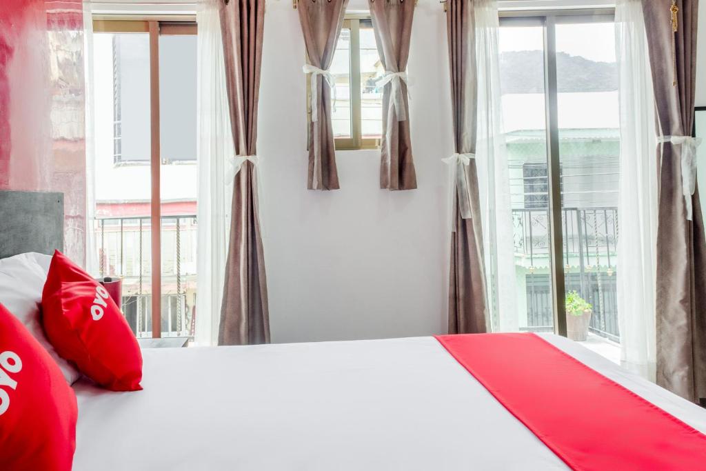 Postel nebo postele na pokoji v ubytování OYO Hotel Gandag