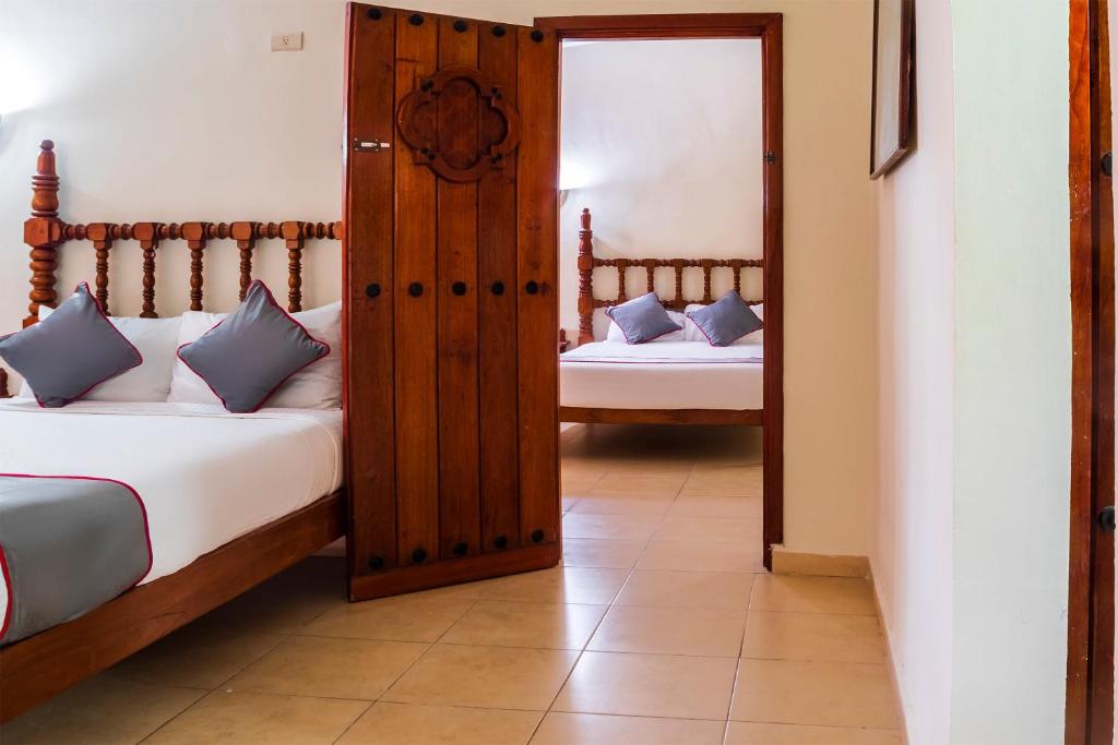 Postel nebo postele na pokoji v ubytování Collection O Hotel Mocambo, Boca del Río