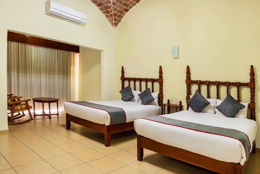 Postel nebo postele na pokoji v ubytování Collection O Hotel Mocambo, Boca del Río