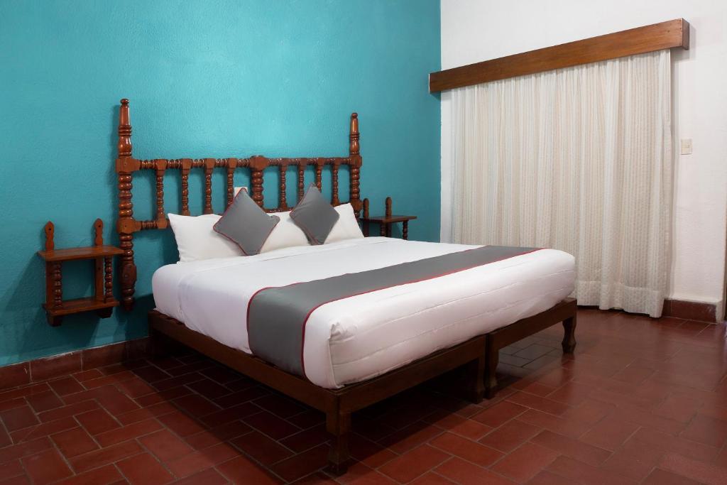 Postel nebo postele na pokoji v ubytování Collection O Hotel Mocambo, Boca del Río