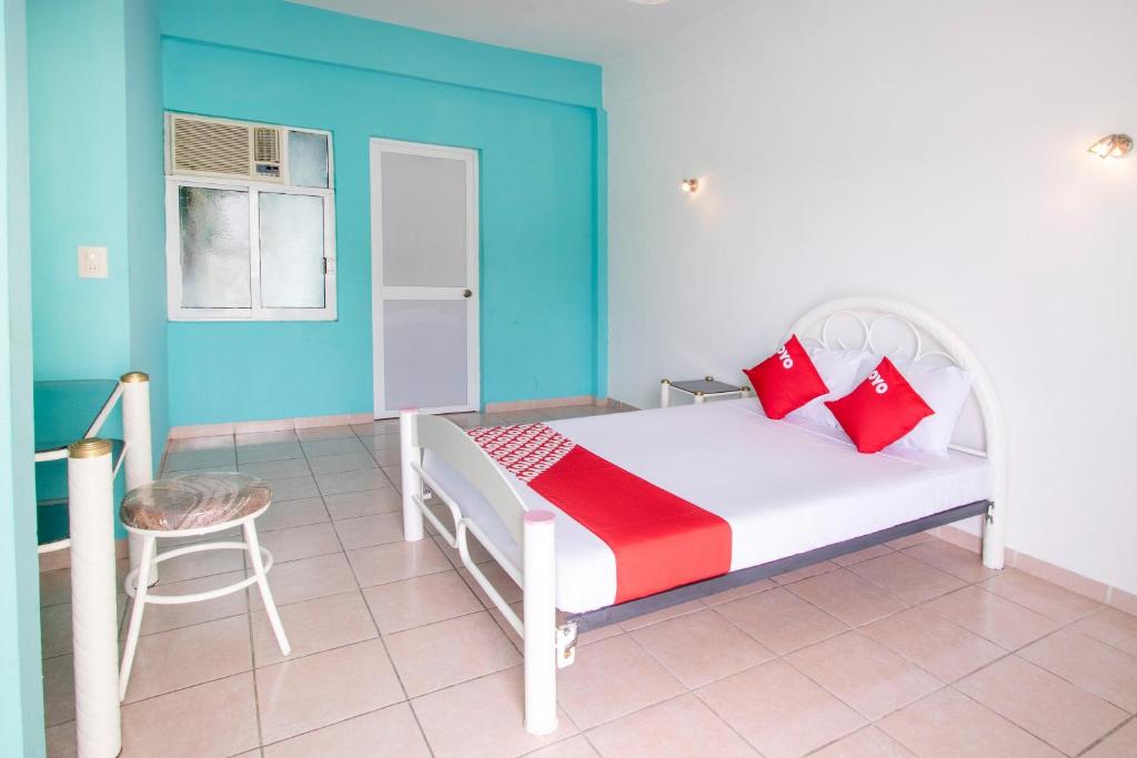 Postel nebo postele na pokoji v ubytování OYO Hotel Estacion,José Cardel,Parque Central Revolución