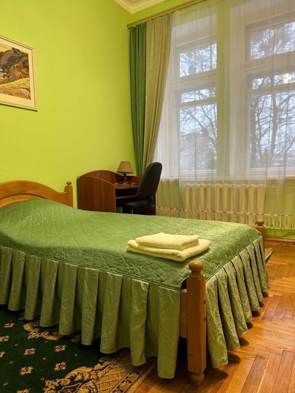 Postel nebo postele na pokoji v ubytování Sikorsky Hotel