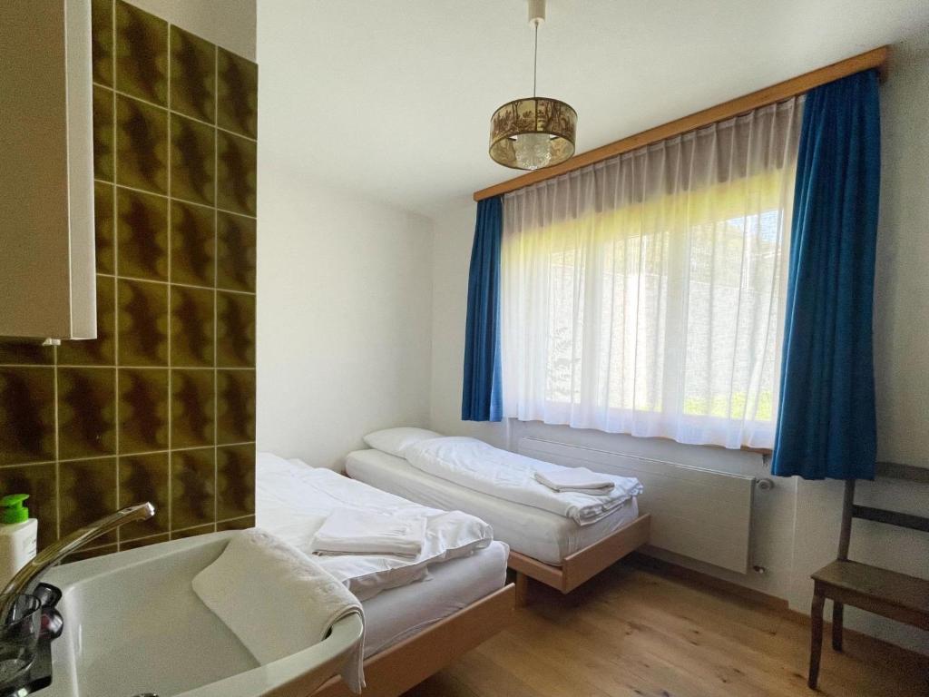 Postel nebo postele na pokoji v ubytování Apartment Fifinhaus by Interhome