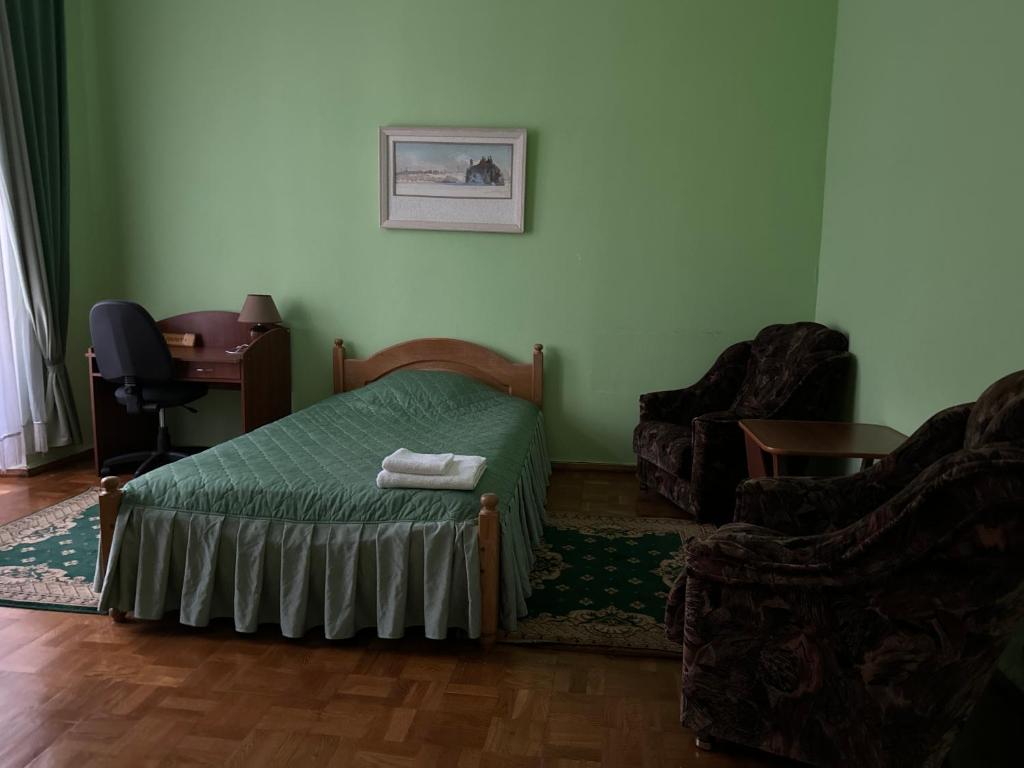 Postel nebo postele na pokoji v ubytování Sikorsky Hotel