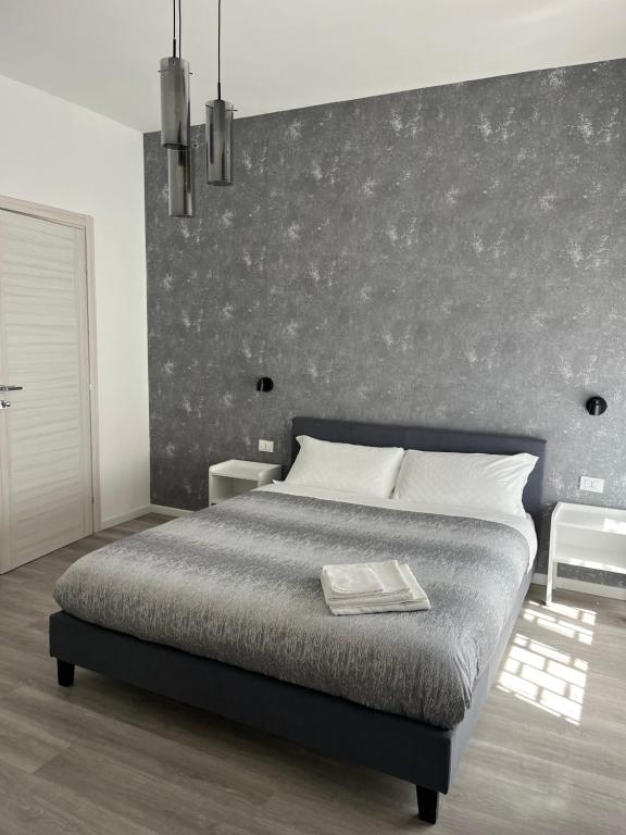 Postel nebo postele na pokoji v ubytování Tiburtina Urban Rooms