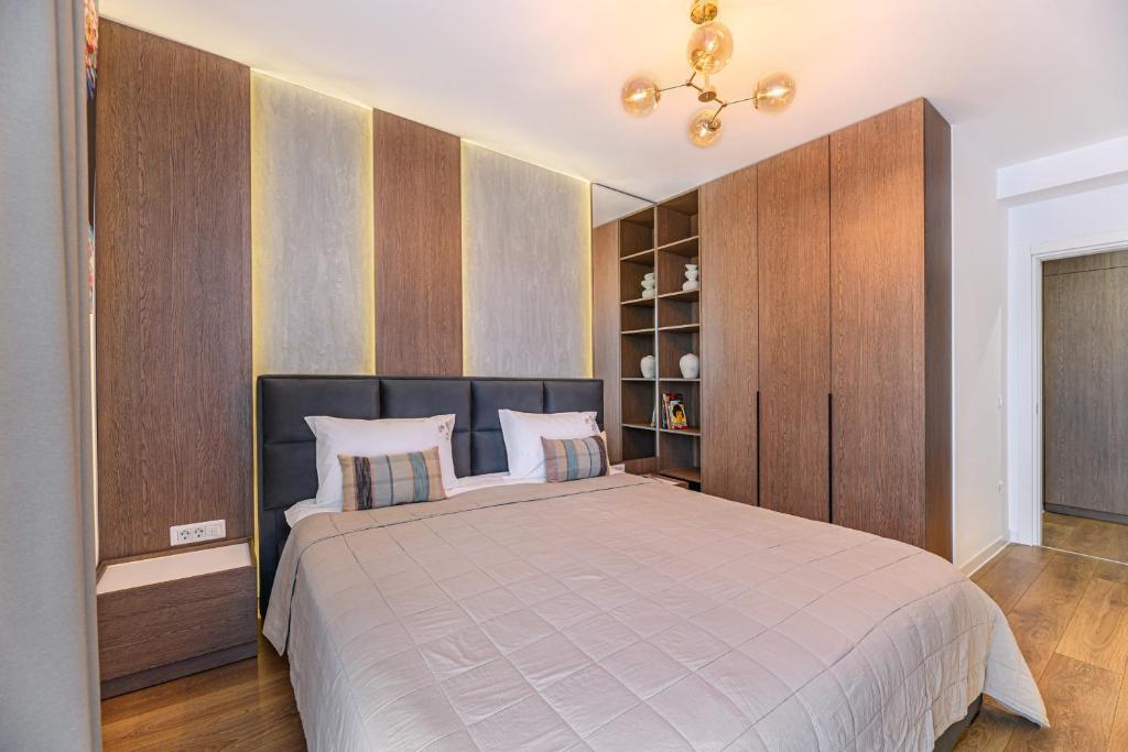Un pat sau paturi într-o cameră la FLH - Avona Lux Apartament