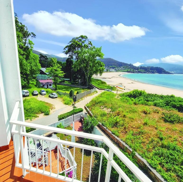 a balcony with a view of a beach at Comfortable house with sea view in Viveiro, 200 m² in Viveiro