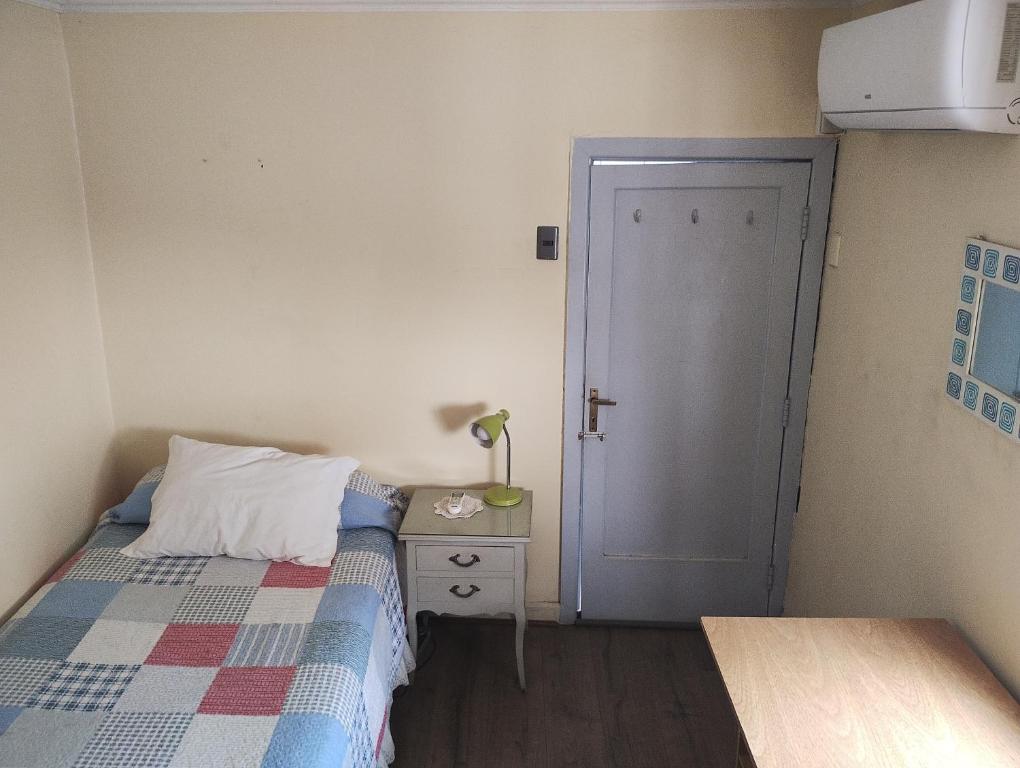 Postel nebo postele na pokoji v ubytování Ñuñoa Vive 1