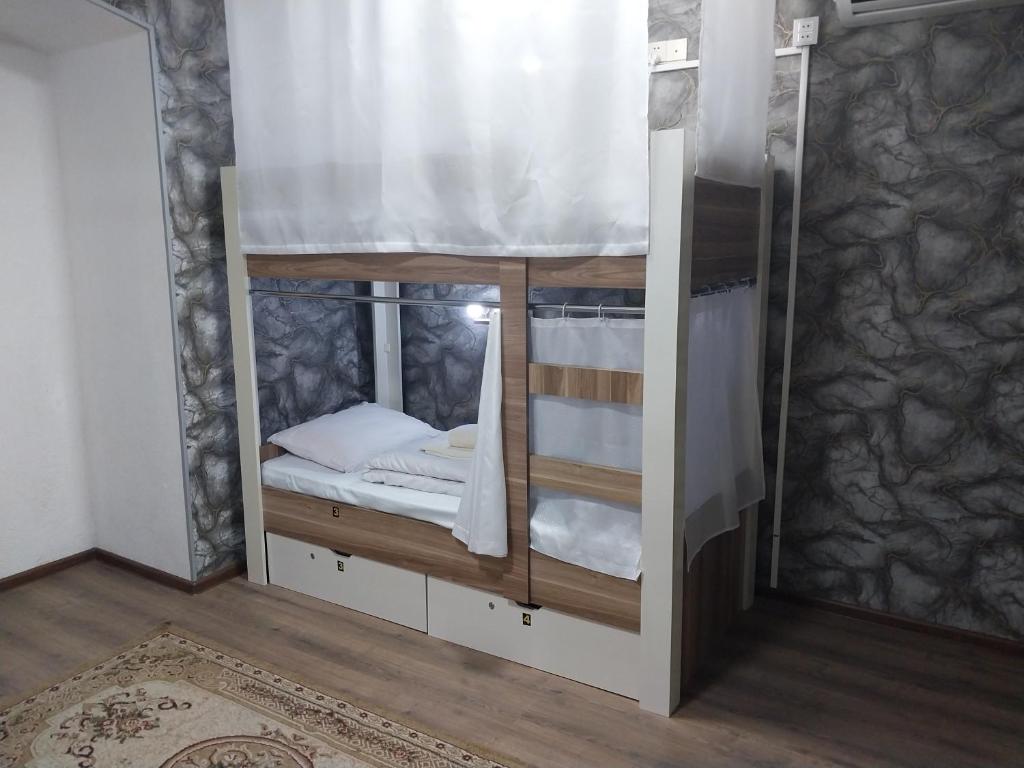 Postel nebo postele na pokoji v ubytování KING Hostel Center