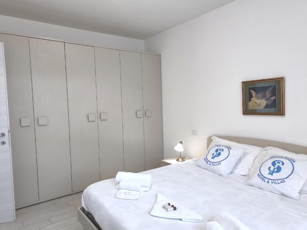 Łóżko lub łóżka w pokoju w obiekcie Residenza Pastrengo