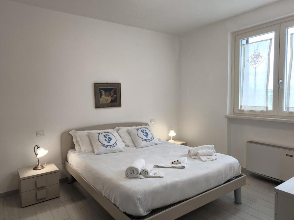 Łóżko lub łóżka w pokoju w obiekcie Residenza Pastrengo