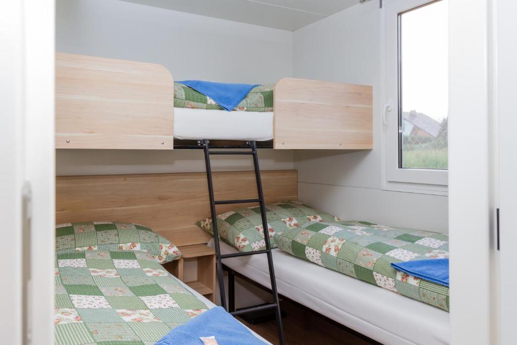 Postel nebo postele na pokoji v ubytování Mara Camping