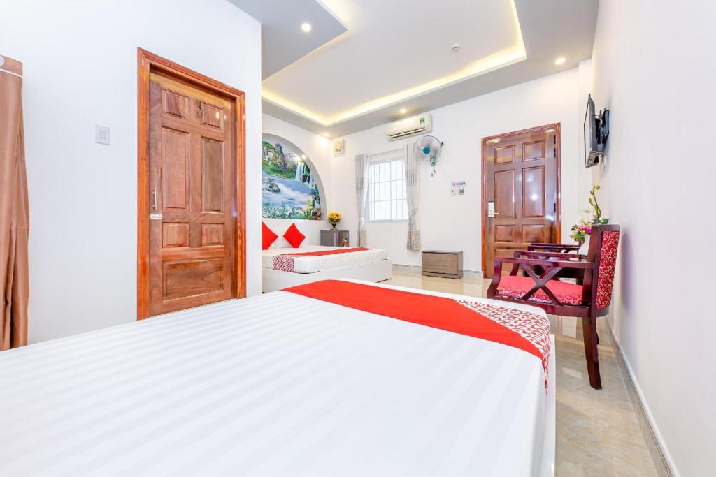 Postel nebo postele na pokoji v ubytování Super OYO 598 Peony Hotel