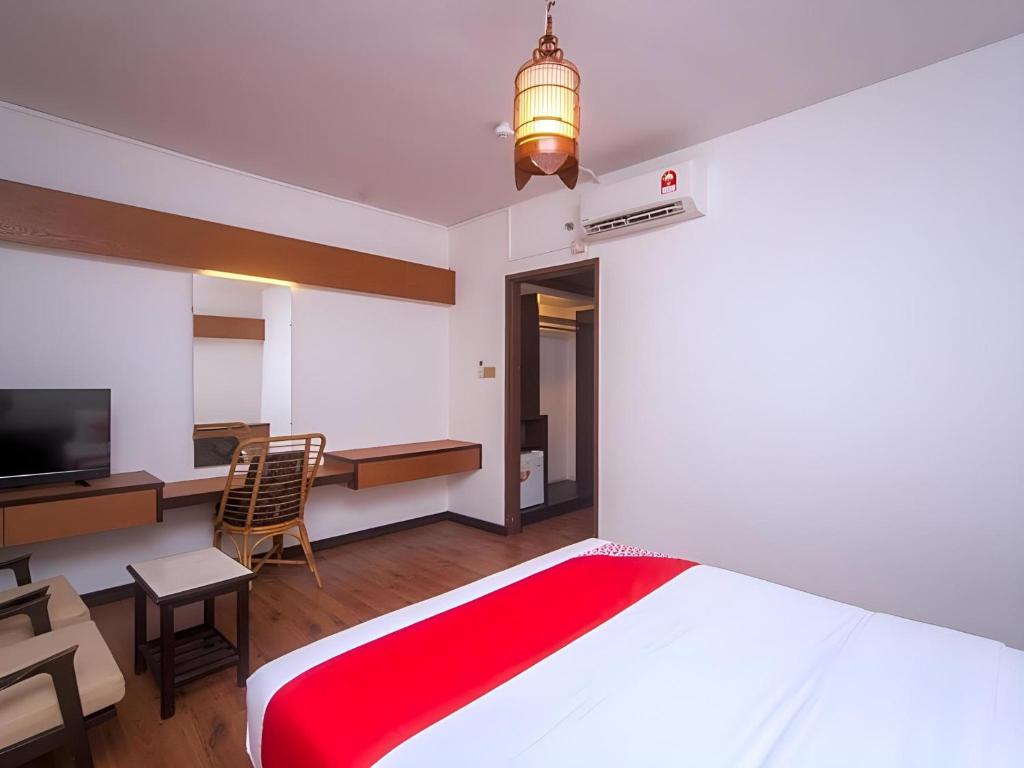 TV a/nebo společenská místnost v ubytování Super OYO 1026 Hotel Lutana