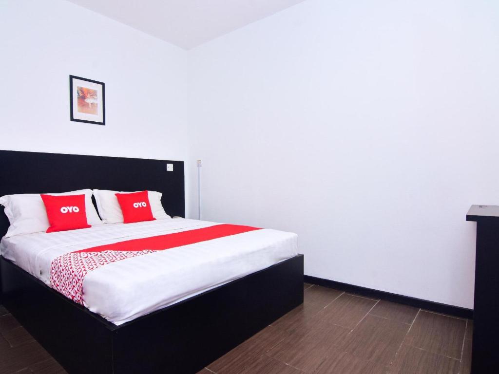 Postel nebo postele na pokoji v ubytování Super OYO 43959 Astana Hotel