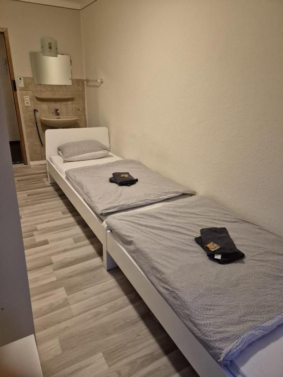 Postel nebo postele na pokoji v ubytování Hotel Garni Krone