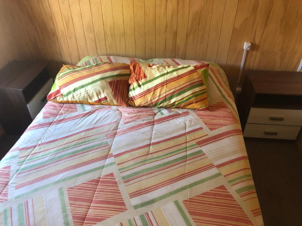 Postel nebo postele na pokoji v ubytování Hostal Huepil