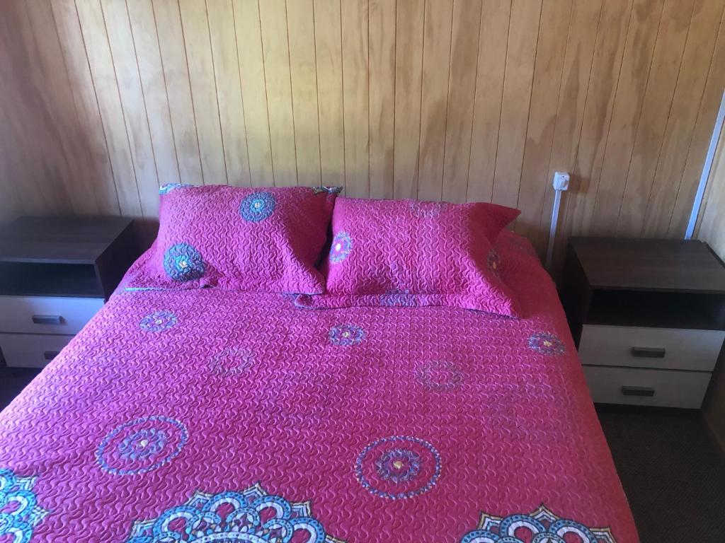 Postel nebo postele na pokoji v ubytování Hostal Huepil