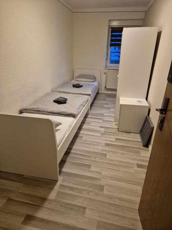Postel nebo postele na pokoji v ubytování Hotel Garni Krone
