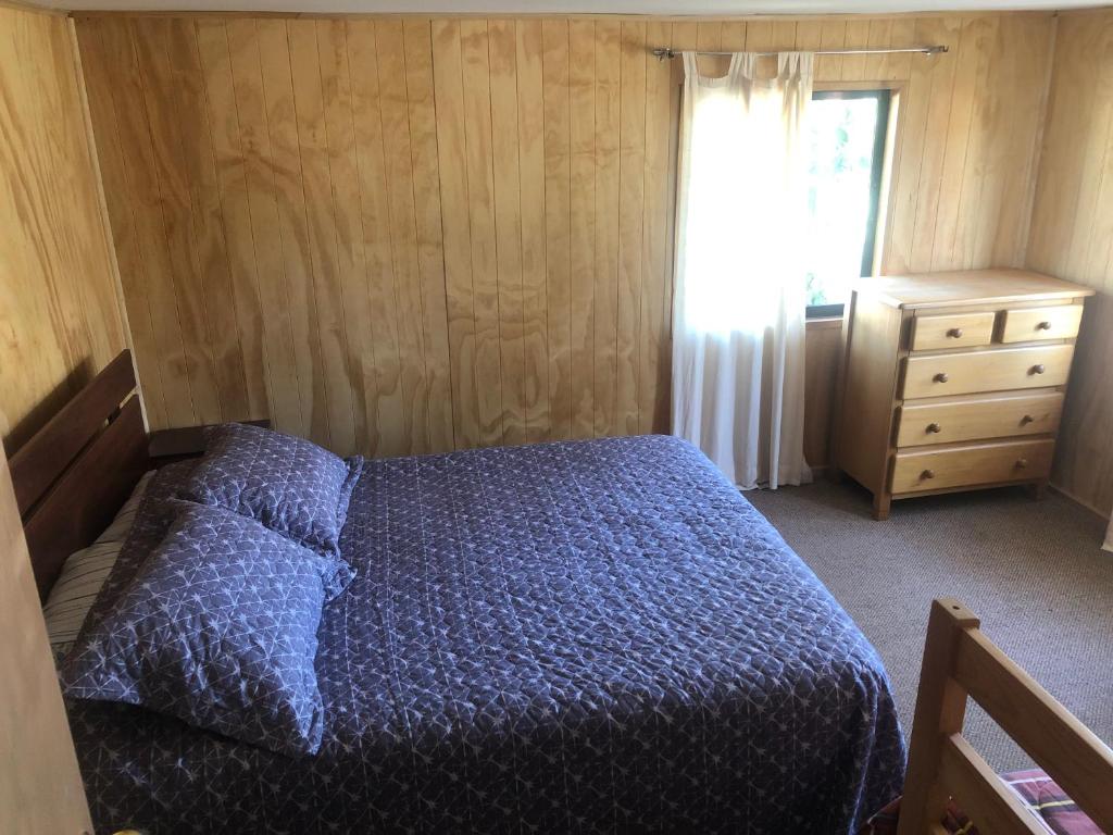 Postel nebo postele na pokoji v ubytování Hostal Huepil