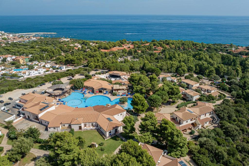 an aerial view of a home with a swimming pool at Club Esse Cala Gonone in Cala Gonone