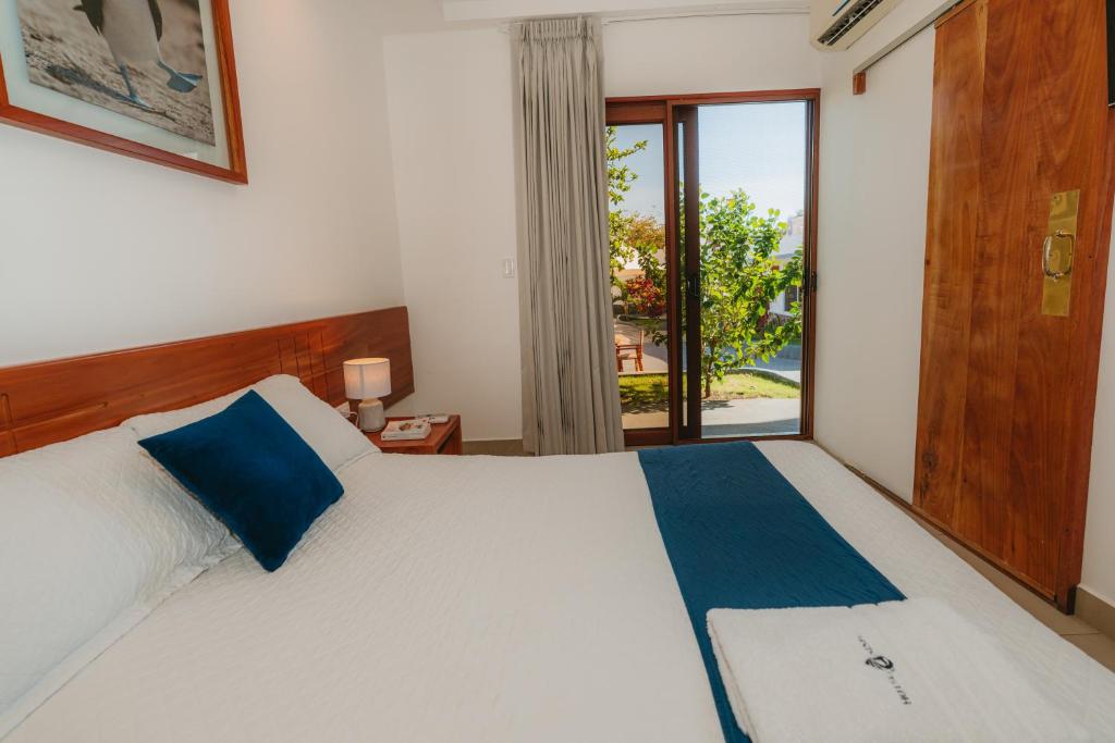 Postel nebo postele na pokoji v ubytování Hotel Ninfa