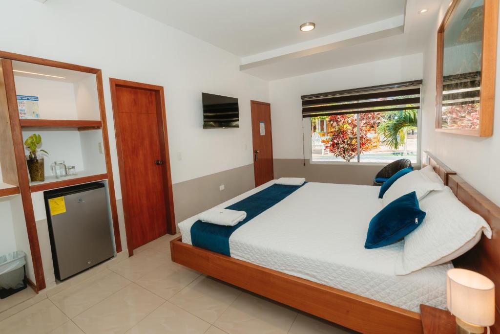 Postel nebo postele na pokoji v ubytování Hotel Ninfa