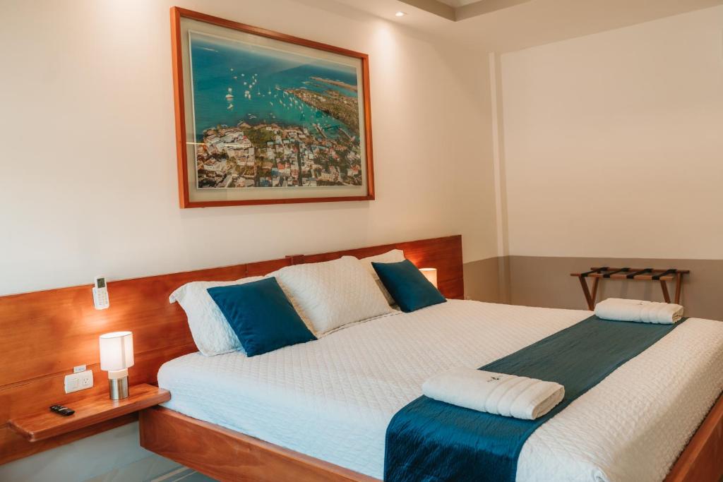 Postel nebo postele na pokoji v ubytování Hotel Ninfa