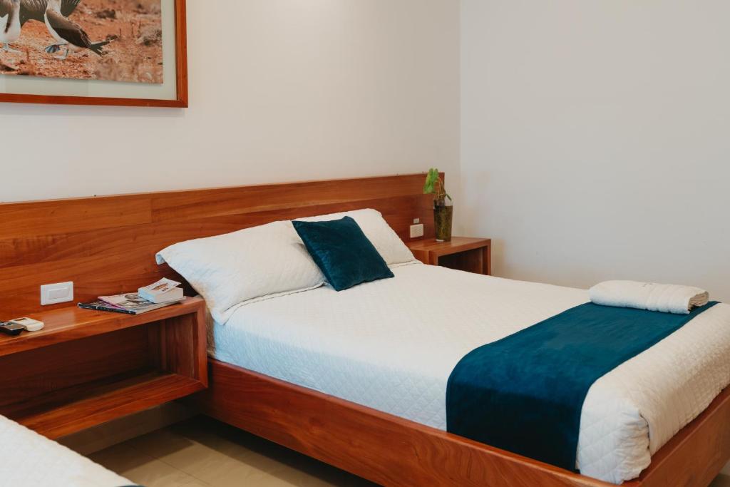 Postel nebo postele na pokoji v ubytování Hotel Ninfa